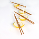 Allowing the wax to set-up using chopsticks to keep the wicks straight